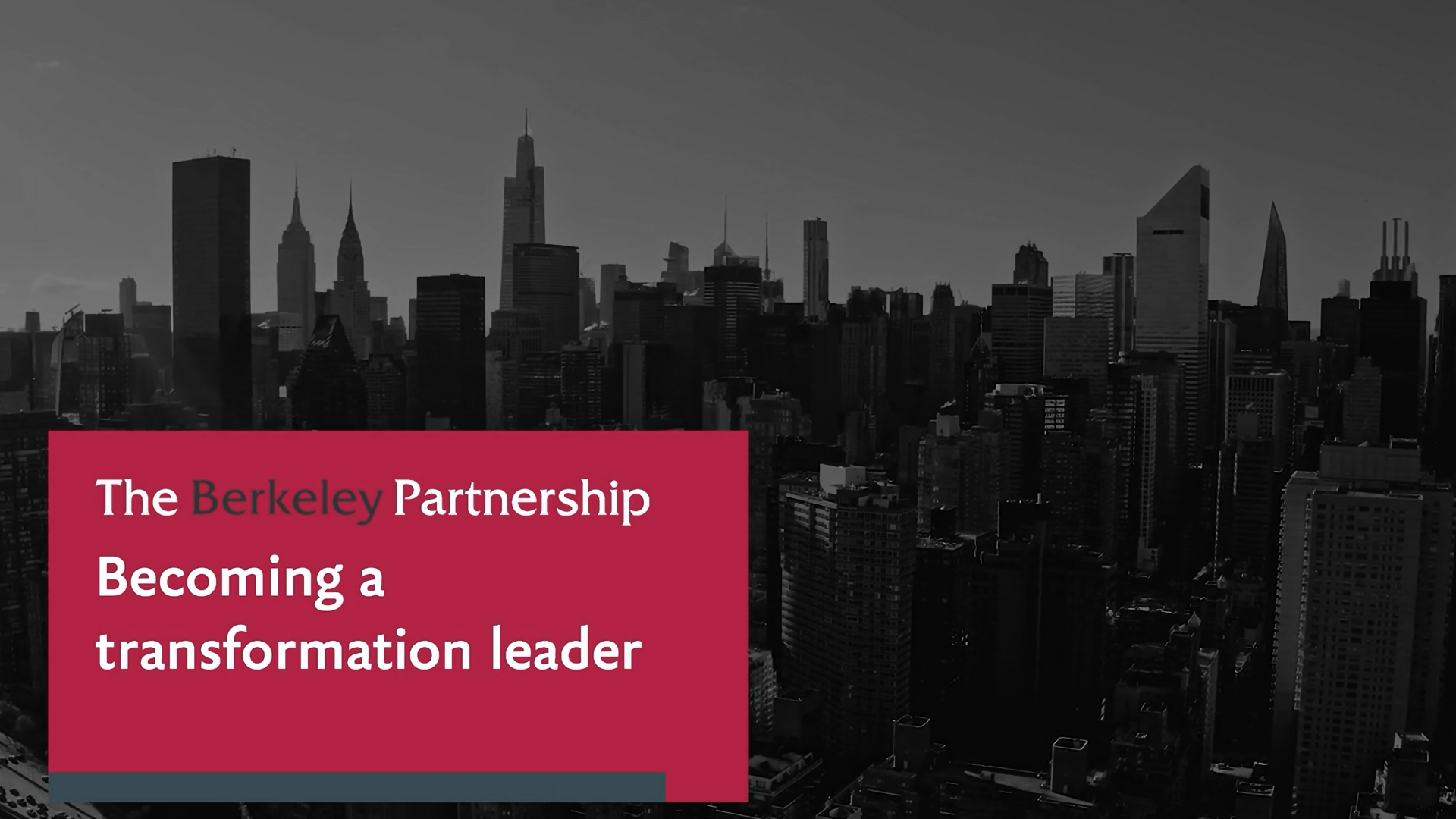 Red panel with the text: Becoming a transformation leader. A greyscale image of a New York City skyline is in the background.